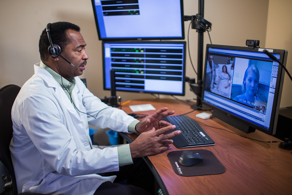 telehealth Provider on video call remotely with patient and clinician.